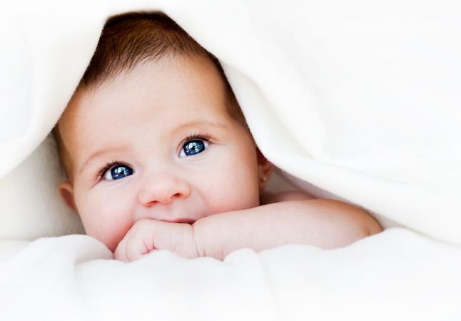 depositphotos 12302401 baby under blanket
