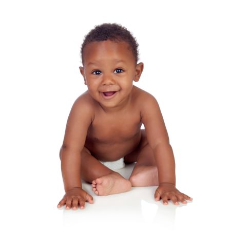 depositphotos 33182033 adorable african baby in diaper sitting on the floor