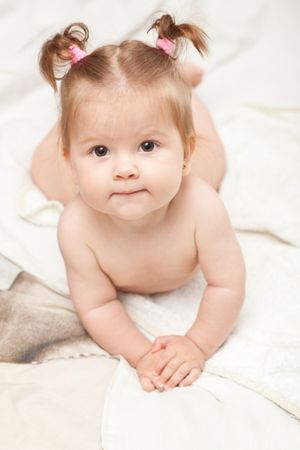 depositphotos 1195954 baby girl in bed soft focus