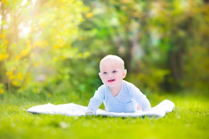 depositphotos 46974187 cute laughing baby in the garden