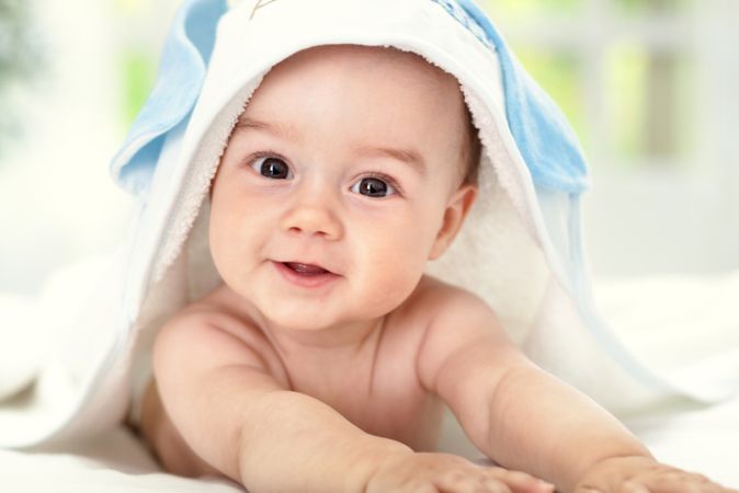 depositphotos 46486943 smiling baby after shower